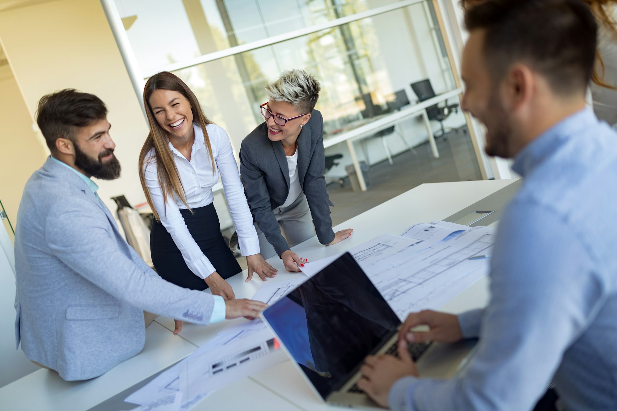 Picture of young architects discussing in office